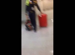 Immigration agent hits Chinese woman