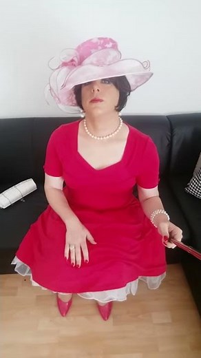 elegant crossdresser lady Christina d´Yvon shows off her petticoat dress and hat for the races.