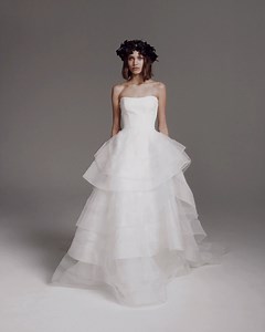 This romantic #VeraWangBride wedding dress features a stretch crepe corset bodice featuring a dramatic tiered ruffle princess skirt! https://bit.ly/3tg6yhH | Designer Bridal Room, Hong Kong | Facebook