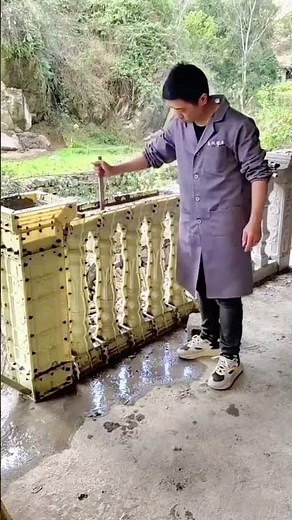 Installing decorative concrete baluster molds on a balcony edge for railing construction