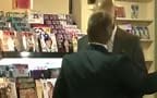 men in suits in sex shop