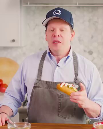 A Sonoran-style hot dog is bacon-wrapped, grilled and will take any tailgate to the next level.  Get Chef Paul's recipe: https://ms.spr.ly/61839x7sU | Hy-Vee | Facebook