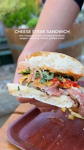 7K views · 39 reactions | Tuck into our Cheese Steak Sandwich! Overflowing with sliced sirloin, smoked provolone, pepper conserve, pickled onions, and rocket. The perfect hearty lunchtime bite! Book a spot now: https://rb.gy/4zhdb | Greenwood Hotel | Facebook