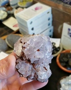 My last Lavender Fluorite from Morocco, this lovely cubic Fluorite has a full on happy rainbow in one of the cubes and is frosted with deep, brick red Hematite. Fluorite has such an industrious nature. As you strive toward your desired goal Fluorite lends it's determination, focus and mental clarity to your task. Use Fluorite to take you into a solid, steady daydream where you plot and plan your life. Spend your time in a delicious meditative state exploring every detail of the life you dream of