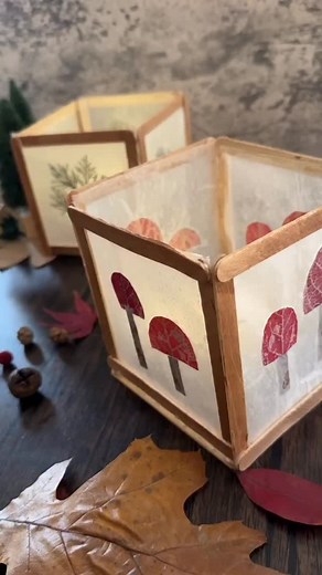 Nature Lantern Craft ✨ I created these simple nature lanterns using supplies I had around my house! It is a lovely craft to display in the fall and winter as the days are getting shorter. You will need: - 20 popsicle sticks - hot glue - wax paper - pressed leaves (or tissue paper) - candle wax - iron - battery candles This project was time consuming but easy to execute. The most challenging part was assembling the sides at the end. I used a popsicle stick base and attached them there to make it