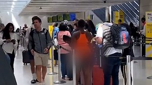 Woman waits in line for Spirit airlines NAKED from waist down