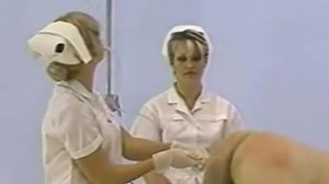 nurse giving male enema