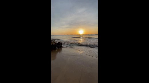 A Beautiful Sunset View on a Quiet Beach with Stunning Rock Reefs