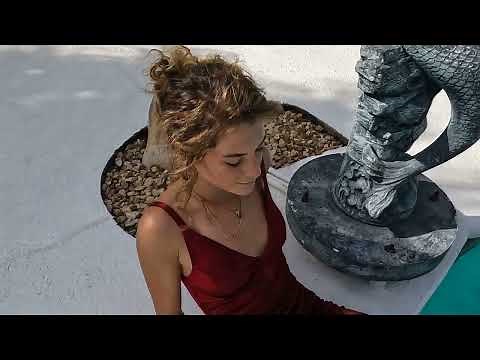 Preview of Nathalia swimming fully clothed her red formal dress