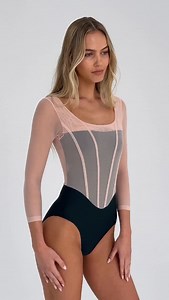 SOFIA Long Sleeve Leotard Fashion-inspired corset styling with supportive mesh and silhouette-enhancing lines, SOFIA is a striking long sleeved leotard that transitions effortlessly from studio to street Featuring a squared tank neckline and fashion-forward corset detailing with airy long sleeves in our featherlight SUPRABLIME®️ mesh layered over our cutting-edge LEOPREME®️ fabric which is supportive yet breathable. The soft-touch material offers exceptional comfort while promoting microcirculat
