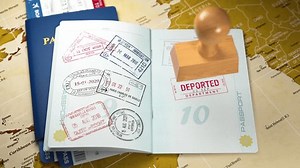 clip-3900379887-deported-red-visa-stamp-open-passport-deportation
