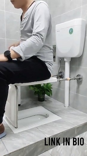 bathroom setup with a squat toilet modified to include a raised seat and handrails for support. Designed for people with mobility challenges, it provides stability and ease of use, making bathrooms safer and more comfortable for elderly or disabled individuals. #Gadgets #bathroomrenovation | knowledge world 01