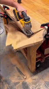 Wood plank positioned on table saw guide rail