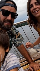 Mother and son tourists on a boat on Lake Titisee in the Black Forest, Germany