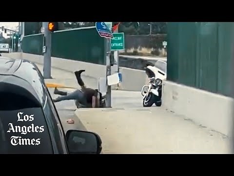 California Highway Patrol officer beaten by attacker on the side of busy freeway