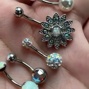 2.6K views · 65 reactions | This handful of belly rings has all your outfits covered!  Shop all our sweetest belly ring sets now  https://www.bodycandy.com/search?q=belly+pack | Body Candy Body Jewelry | Facebook