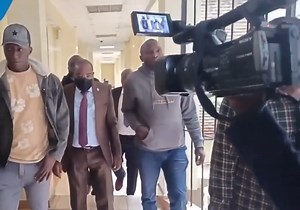 10K views · 79 reactions | Juja MP George Koimburi, appearing physically weak, is assisted to climb stairs at Milimani Law Courts ahead of plea taking in fake abduction case | 7 News Global | Facebook