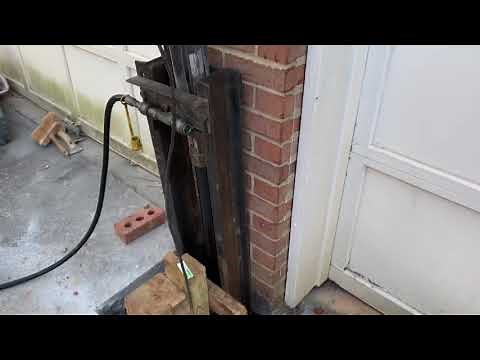 JSA Atlanta Foundation Repair "lifting a settling cracked brick garage column."