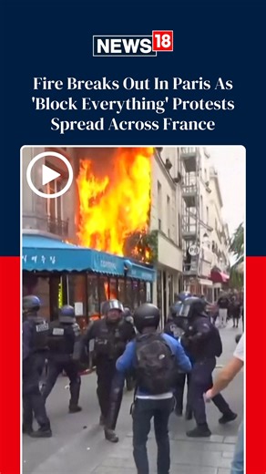 'Block Everything' protests spread across France, buildings put on fire, police uses tear gas and water cannon on protesters #france #blockeverything #paris #protests | News18