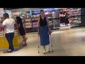 Amputee lady crutches life after Amputation: walking uneven hill
