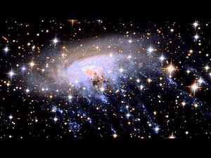 Panning across Spiral Galaxy ESO 137-001 | Hubble FriendsofNASA.org: This video pans across the sky near to spiral galaxy ESO 137-001 in the constellation of Triangulum Australe (The Southern Triangle), ending on a view of the galaxy itself. This delicate and beautiful spiral galaxy is undergoing ram pressure stripping, where streaks of bright gas are being dragged out into space by the cluster it is moving through. Distance: 220 million light years Credit: NASA, European Space Agency (ESA) Ackn