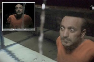 ISIS jihadis execute captive by drowning him in FISH TANK in sick new video