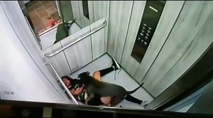 Graphic footage reveals horrific moment bloody woman attempts to fight off pit bull attacking her in an elevator