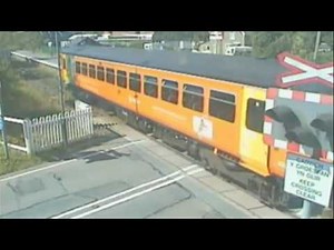 Video shows shocking pram near-miss at level crossing