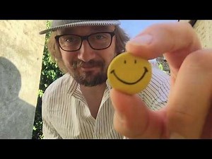 The smiley face icon with Ed Gill