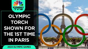 #WATCH | The Olympic torch for the Paris 2024 Olympic Games was revealed on the River Seine on July 25. French athletes & officials celebrated the moment. Even Olympian Usain Bolt joined the unveiling of the torch #2024ParisOlympicGames #Olympics #Paris #UsainBolt | CNBC-TV18 | Facebook