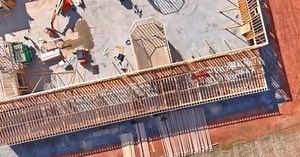 Slab on grade foundation footing timber frame building under construction