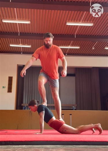 Strong woman gets up with a man standing on her back! | Awesome