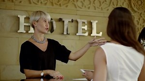 clip-32323882-hotel-manager-explaining-client-rules-showing-by