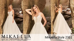 Mikaella Style 2331. If you want to be the belle of the ball, then you’ll love this dress. With its princess-inspired Organza full skirt that has pockets, and beautiful lace appliqued bodice with Sequin Tulle underneath, this gown will make you feel like a modern-day princess. To add the perfect amount of allure, this gown features a plunging neckline lined in nude Italian Tulle. https://mikaellabridal.com/collections/gowns-collection/style-2331 | Mikaella Bridal