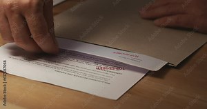 Agent pick-up confidential important documents with seal Top Secret, close-up shot Stock-Video