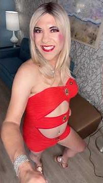 Crossdresser Alexandra Modeling Red Bodysuit with Gold Rhinestone Sandals