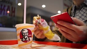 Minsk, Belarus, July 5, 2017: in the KFC Restaurant, a Woman Uses a Smartphone and Eats Stock Video - Video of leisure, hamburger: 95734409