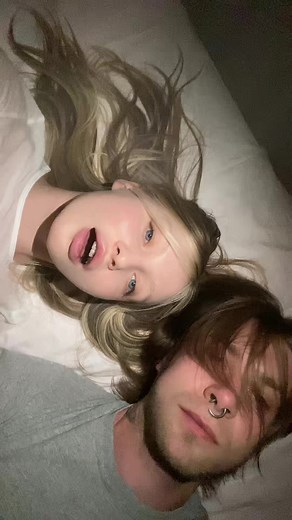 Intimate Moments Captured in a Dimly Lit Bedroom