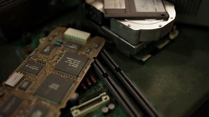 old computer floppy disk and motherboard