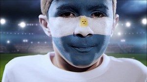 clip-1009138712-boy-yelling-goal-his-face-painted-argentina