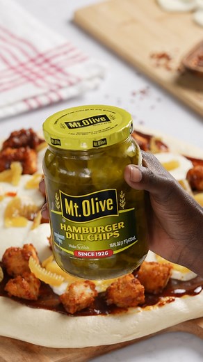 👍 THUMBS UP if you’re a Hamburger Dill Chips fan! We love these tasty pickle chips on everything including sandwiches, salads, pizzas, & more! 🥒 Tell us how you use Hamburger Dill Chips in the comments! 🍕 Nashville Hot Chicken Pizza recipe: www.mtolivepickles.com/recipe-items/nashville-hot-chicken-pizza #NashvilleHot #NashvilleHotChicken #Pickles #PickleLover #PickleLovers #DillPickles #PizzaRecipes #Mozzarella #CrispyChicken #FriedChicken | Mt. Olive Pickles