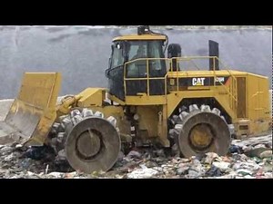 Crushing Garbage With a CAT 826H Compactor Loader