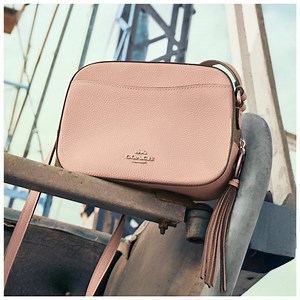 Puppy love. Our vintage-inspired camera bag gets a Disney refresh courtesy of 101 Dalmatians. Shop now: on.coach.com/DisneyCoach | Coach