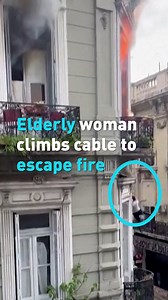 9.2K views · 198 reactions | An elderly woman in the capital of Argentina fled a fire by climbing down a cable attached to the outside of the building. The woman reportedly suffered burns over 70% of her body and head injuries. The fire engulfed the second floor of a downtown three-story structure in Buenos Aires. The cause of the fire is under investigation by authorities. #CGTNAmerica | CGTN | Facebook