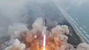 Slow motion view of Starship ascending through clouds above Starbase | SpaceX