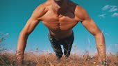 Workout. Strong Man doing Push-ups with Claps Outside on Nature. Slow...