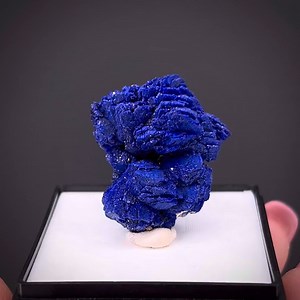 Azurite rosette - Christiana Mine, Lavrion, Lavreotiki, Attica, Greece More info: https://www.irocks.com/minerals/specimen/51727 Quality clusters of Azurites, especially when they take a rosette-like form, are uncommon from Greece and highly sought-after. This fine, large thumbnail features Azurite crystals up to about 8 mm. It is scintillating and lustrous, textured surfaces and a robust, blue-violet color give the piece a vivid and attractive appearance. Collected in 2012 from the well-known C