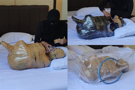 The process of wrapping the ball into a mummification ball with duct tape