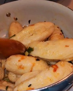 Biggest Guyanese Style Duff Recipe, Boiled and Fry.. What's your favorite veggies, curry or protein to go with these fat Duff. Let me know if you do your this way. Love my mom's catfish curry with it. Sandy's Duff / Dumpling Recipe 4 cups of all purpose Flour 1 Tablespoon baking powder 1 teaspoon yeast optional 1 teaspoon Salt 2 -3 Tablespoon Sugar Water to knead like sada roti or bread and rest 15 minutes before cook, like I did. To Sautéed or Stir-fry 1 small onion 2 sprigs of scallions 1 smal