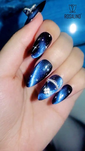 Galaxy Nail Art! 🌟🌌 . Saturn spinning on my fingertips🪐, stars shining, and the Milky Way flowing 🌠~ this is my favorite manicure of the week! . . . . . #Rosalind #Rosalindgelpolish #Rosalindnailart #mani #nails #nailart #nailsdesign #creativenails #nailsaddict #nailofinstagram #nailsporn #nailsoftheday #nailenthusiast #gelpolish #nails💅 #lovelynails #naillove #nailtips #easynails #shortnails #nailsalon #galaxynails #cateyegel #starburstnails #cateyenails #almondnails #abstractnails #nailar